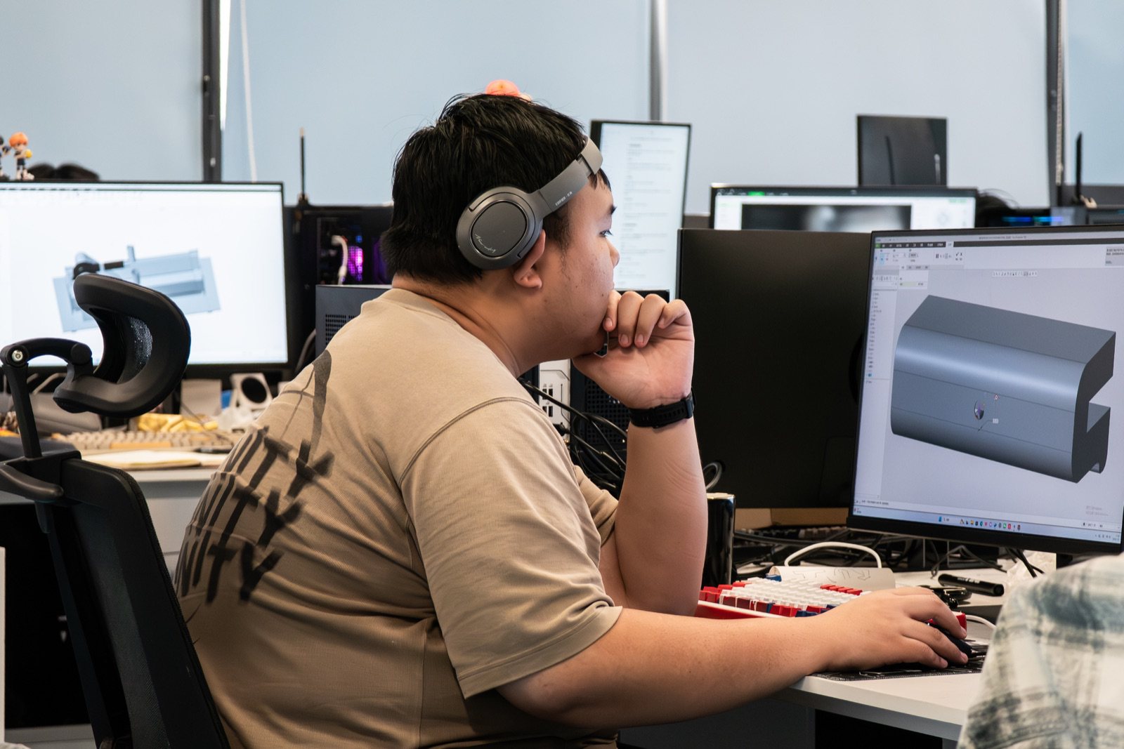 An engineer modelling the garment-care system in CAD