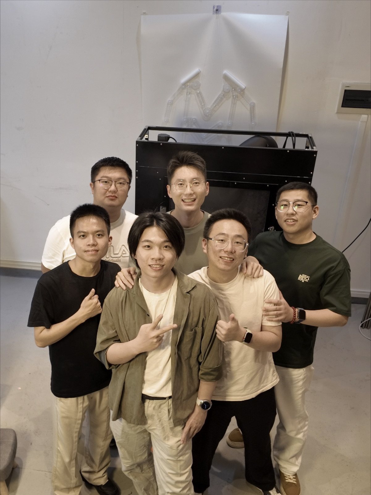 The engineering team with the first functional prototype rig